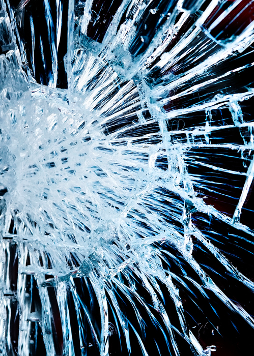 the texture is a shiny mirror surface with small and large cracks