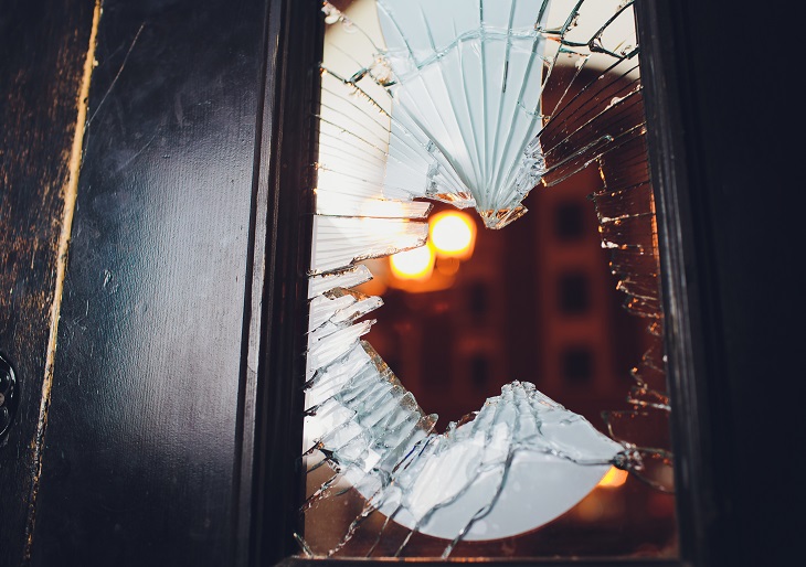 Broken glass black door of the shop